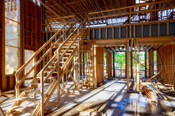 istock Wood frame of house under beam construction 967096294