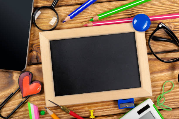 istock School office supplies on wooden background 967096432