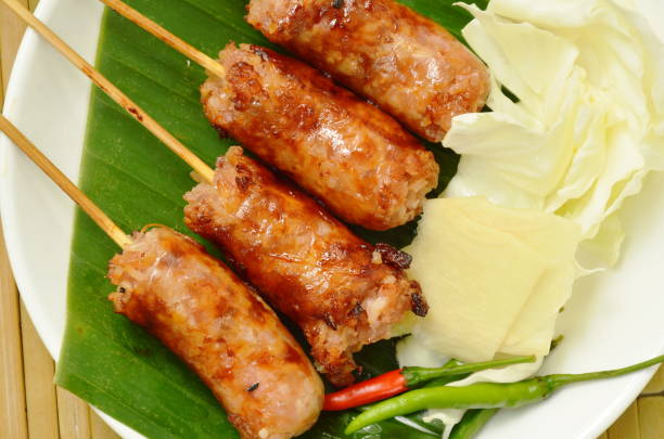 istock grilled Thai sausage stuffed rice and pork with fresh vegetable 967099812