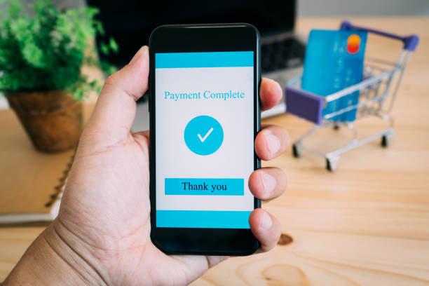 istock Hands using smartphone and laptop computer for online shopping at home 967108742