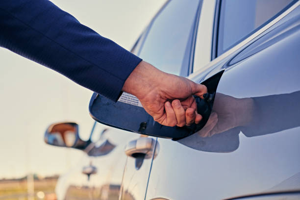 istock Man wants to open a gasoline tank. 967110208
