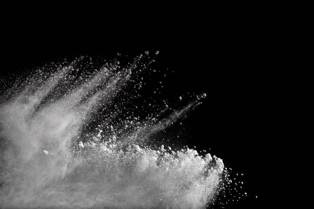 istock Launched white powder splash on black background. Bizarre forms of of white powder explosion cloud against dark background. 967117786