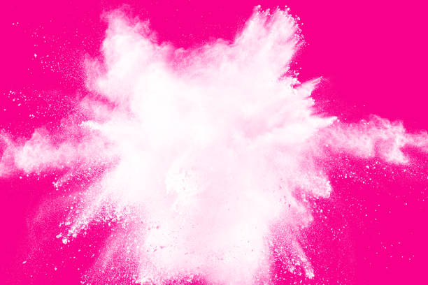 istock White powder dust explosion isolated on pink background. 967120052