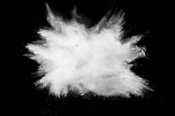 istock Launched white powder splash on black background. Bizarre forms of of white powder explosion cloud against dark background. 967120112