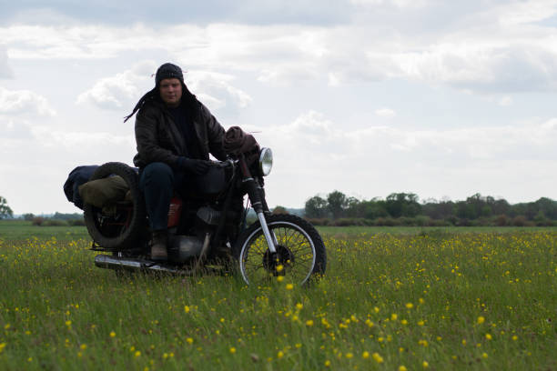 istock A post apocalyptic man on motorcycle in a meadow 967120794