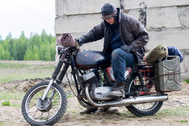 istock A post apocalyptic man on motorcycle near the destroyed building 967121122