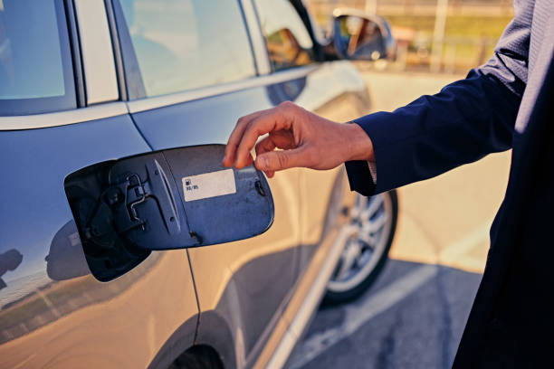 istock Man wants to open a gasoline tank. 967122086