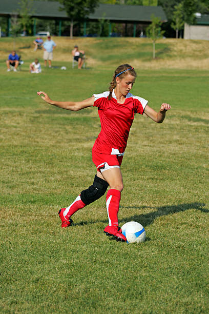 istock Young Female Soccer Player in Open Field Breakaway 96712362