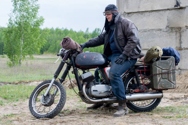 istock A post apocalyptic man on motorcycle near the destroyed building 967125014