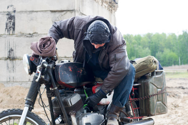 istock A post apocalyptic man on motorcycle near the destroyed building 967125924
