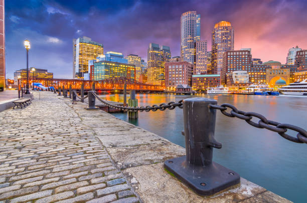 Boston, Massachusetts, USA Harbor and Skyline Boston, Massachusetts, USA harbor and cityscape at dusk. boston skyline night skyscraper stock pictures, royalty-free photos & images