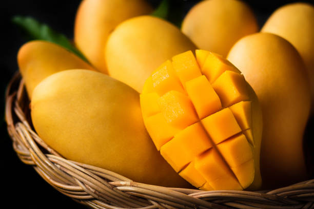 istock Yellow Mango Beautiful skin In the basket Blackboard background 967129500