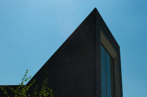 istock Slate wall building aganist the blue sky 967131056