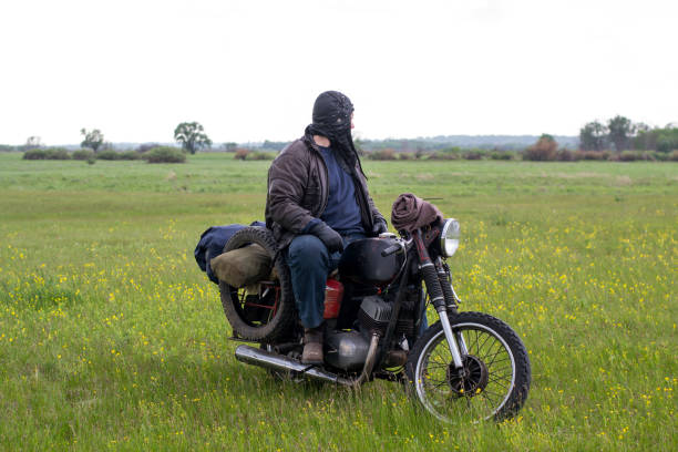 istock A post apocalyptic man on motorcycle in a meadow 967133634