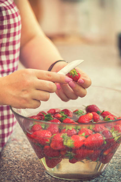 istock Washing strawberries for making homemade jam 967133722