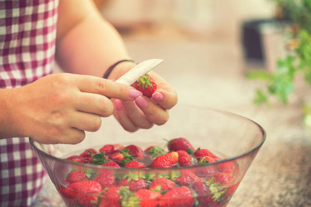 istock Washing strawberries for making homemade jam 967133926