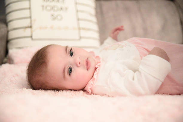 Little girl lying on the sofa
