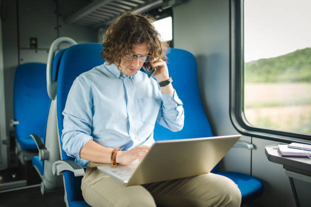 istock Businessman phone call in train 967137852