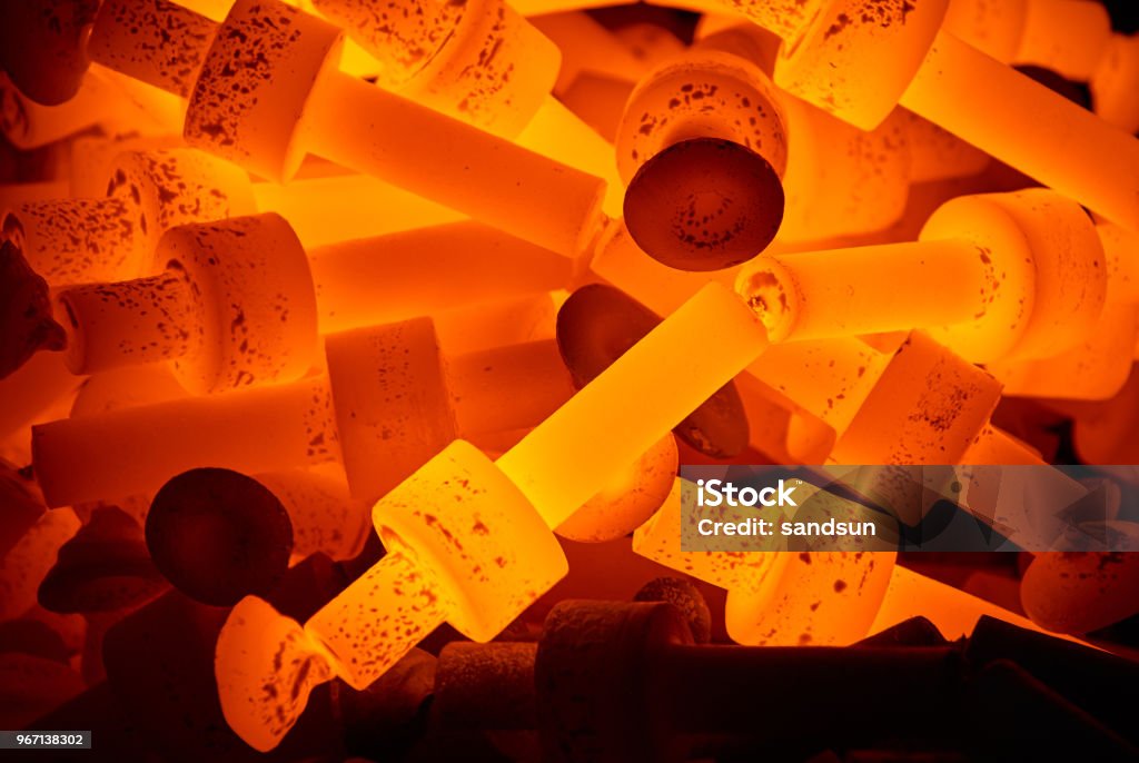 pile of hot steel parts pile of hot steel parts background close up Metal Stock Photo