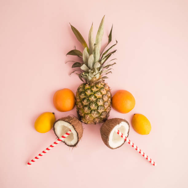 istock Creative layout of fresh fruit slices on rose background abstract. 967190588
