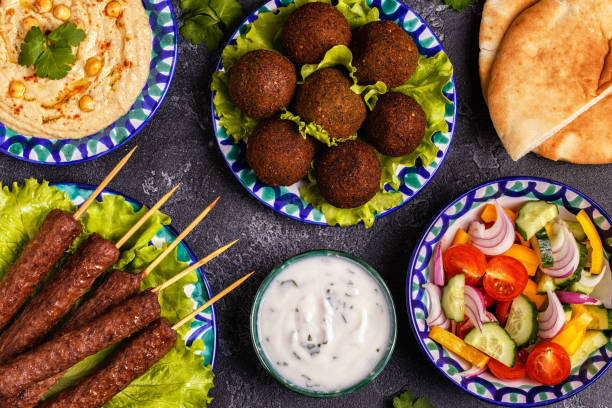 istock Classic kebabs, falafel and hummus on the plates. 967197738