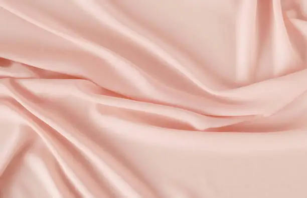 Photo of silk fabric  in pastel color background texture
