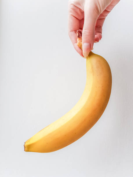 istock Ripe yellow banana in hand 967221610
