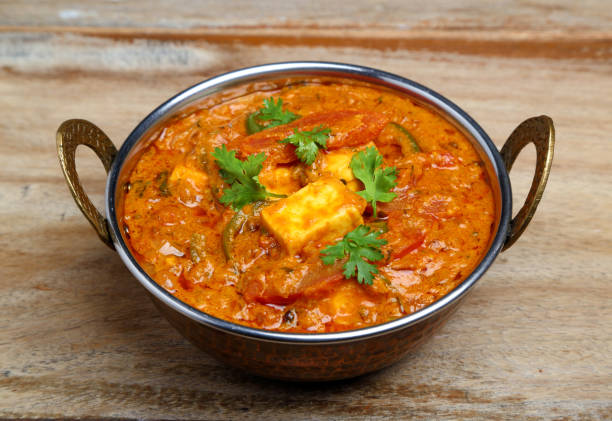 istock Indian Food or Indian Curry in a copper brass serving bowl. 967234596