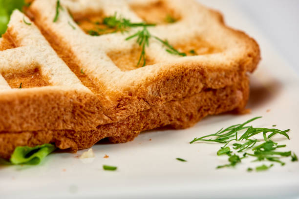 Crispy sandwich with ham and salad. Breakfast.