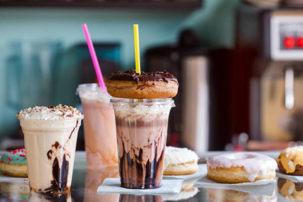 Milkshakes with donuts for takeaway in a cafe stock photo