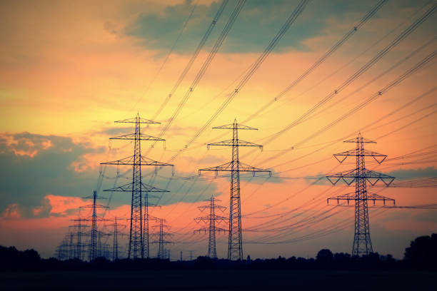 istock Electricity pylon silhouettes at sunset in Germany 967260746