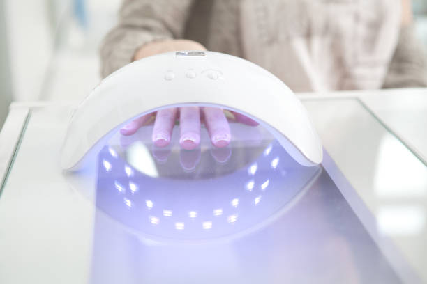 istock UV lamp gel polish manicure process 967260794