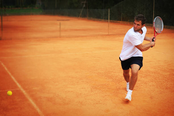 Tennis, player strong punches the ball with a racket