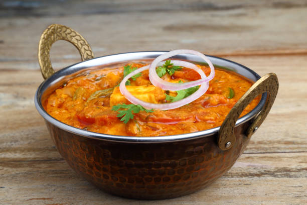 istock Indian Food or Indian Curry in a copper brass serving bowl. 967265826