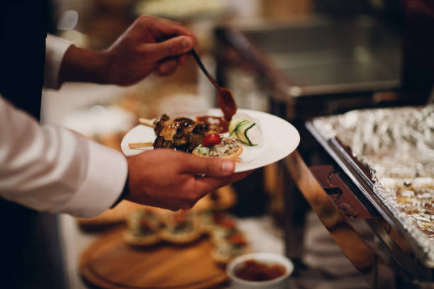 istock Hand and food. Catering concept. 967265986