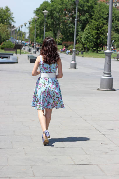 istock Young woman walking in the Park 967266914