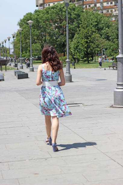 istock Young woman walking in the Park 967266936