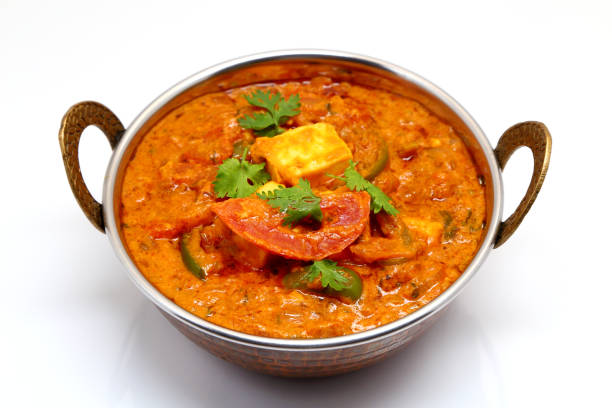 istock Indian Food or Indian Curry in a copper brass serving bowl. 967269174