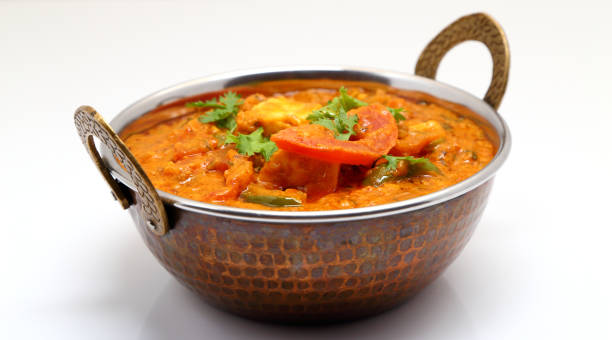 istock Indian Food or Indian Curry in a copper brass serving bowl. 967269332