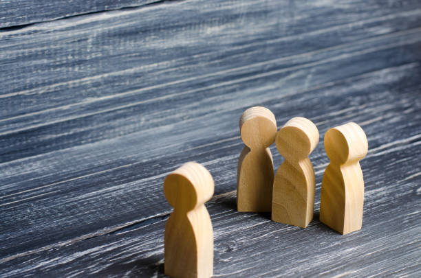 istock Three people meet one. Three people are aggressively attuned to one. People conduct an interview and a meeting. The concept of attack, threats, encounters, education. Businessmen stand in a group of three. 967278904