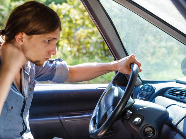 istock Angry man in car screaming while driving 967279386