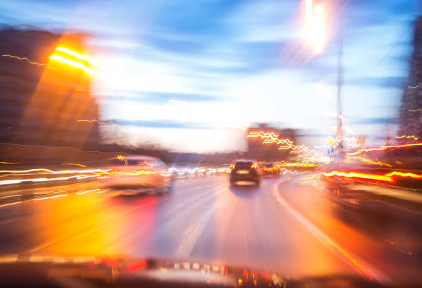 istock Evening traffic with cars in motion blur, view from windshield 967296846