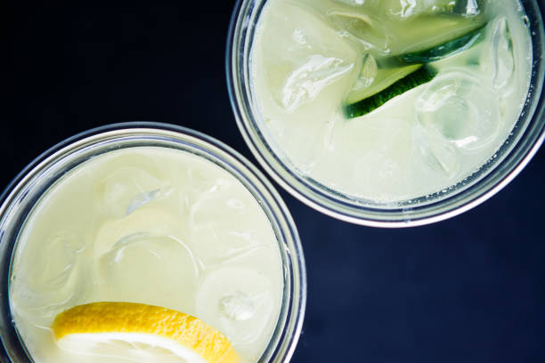 istock Lemon and cucumber lemonade in plastic cups 967297088