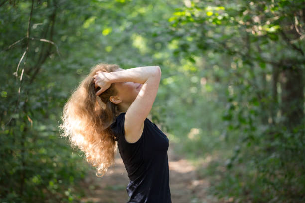 istock Young girl on walk in forest. 967304414