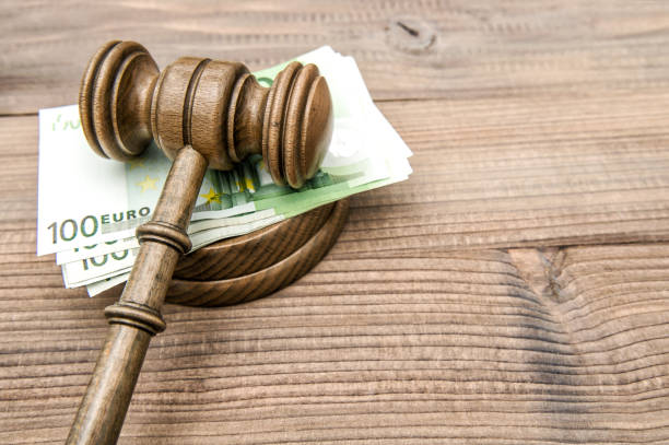 istock Judges gavel euro banknotes Auctioneer hammer 967305730