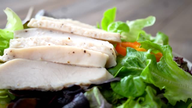 Healthy fresh green salad with boiled chicken breast
