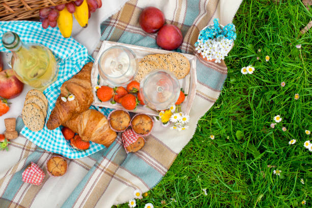 istock Picnic Basket with apples and bread. Family disfocused. Copy space 967312218