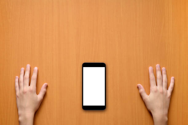 istock Hands and smartphone on desk top view 967318714