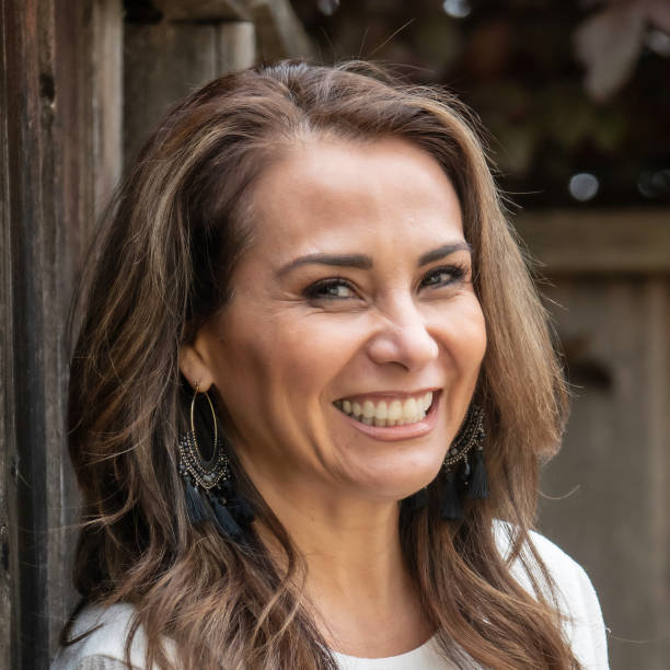 istock Smiling mature woman looking at the camera 967321094