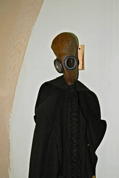 istock An antique gas mask and a greatcoat 967321100